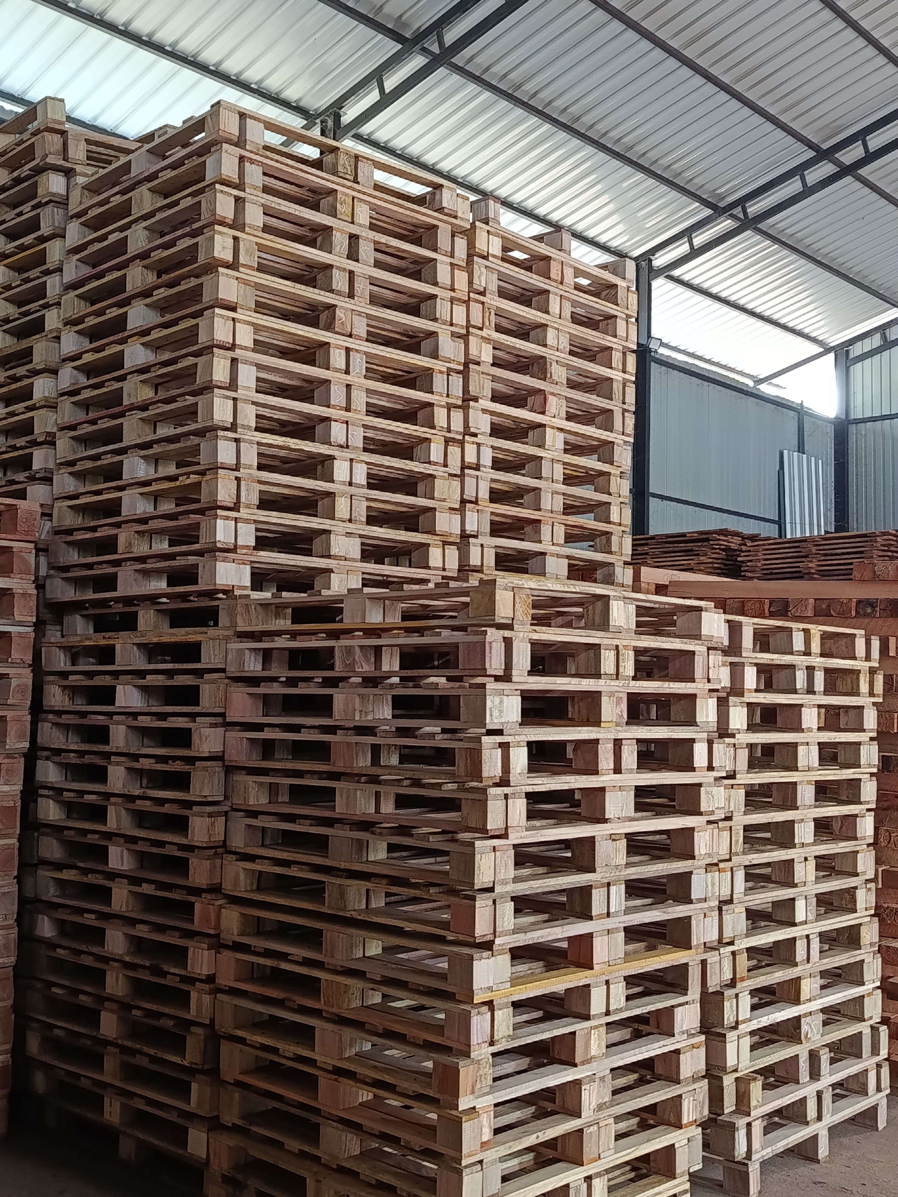 Stacked Wooden Pallets in Dissanayake Enterprises Warehouse