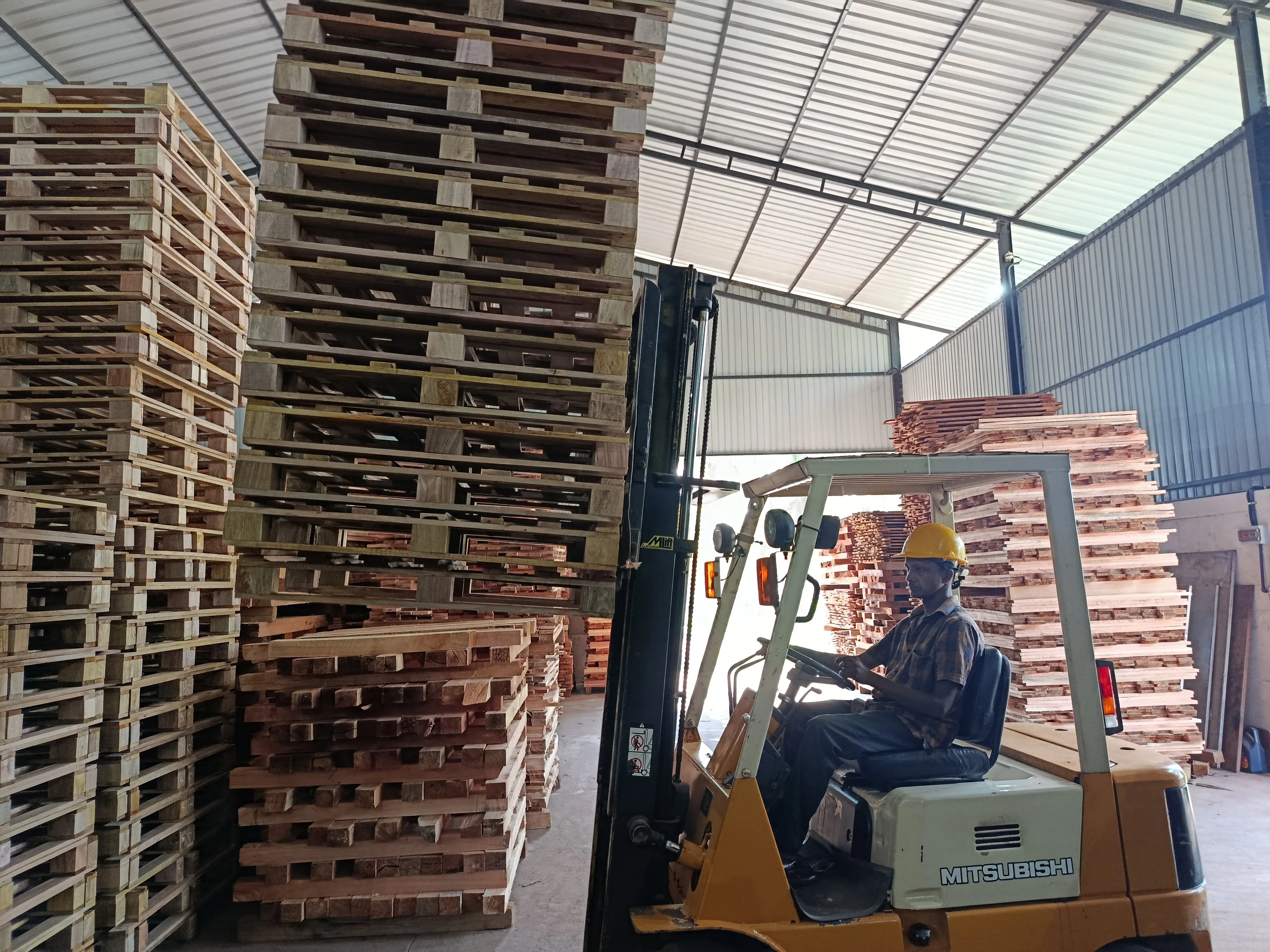 Forklift Loading Wooden Pallets at Dissanayake Enterprises
